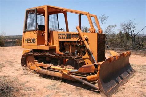 Put an acceptable jack in contact with the guard before removing the cap screws. . Case 1150b dozer weight